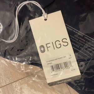 Brand new Figs scrubs top and bottom in navy blue. Never opened, tags attached.
